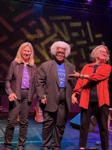 Holly performing with Jan Martinelli and Tammy Hall at the National Womens Music Festival 2026