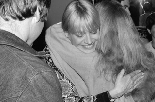 Mary Travers hugging Holly Near ©Irene Young